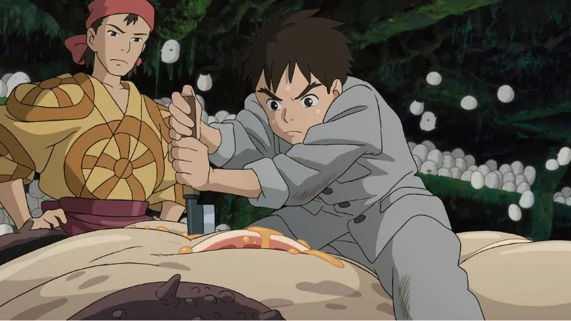 魚をさばく眞人と、それを見守るキリコ